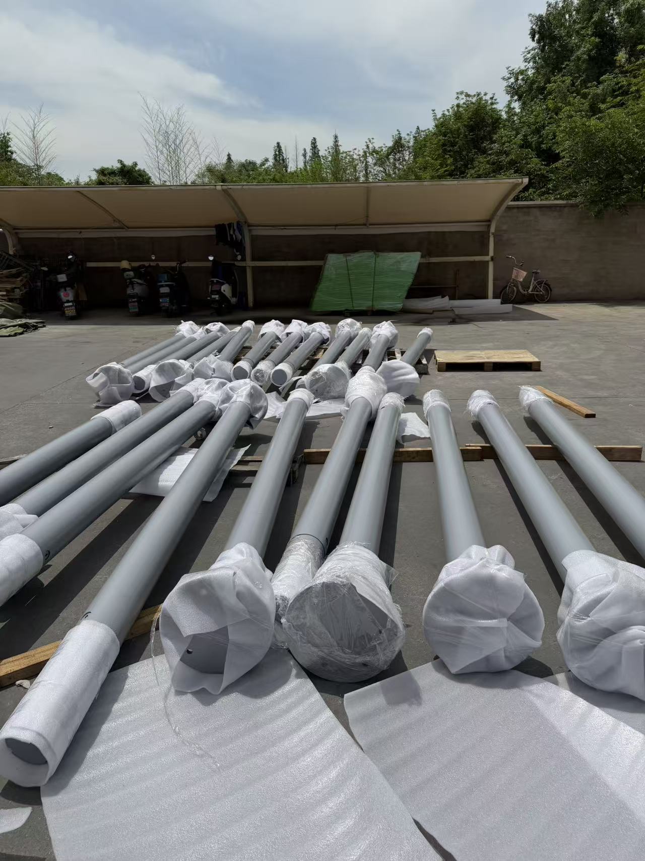 Steel bollard posts wrapped for shipping on the ground