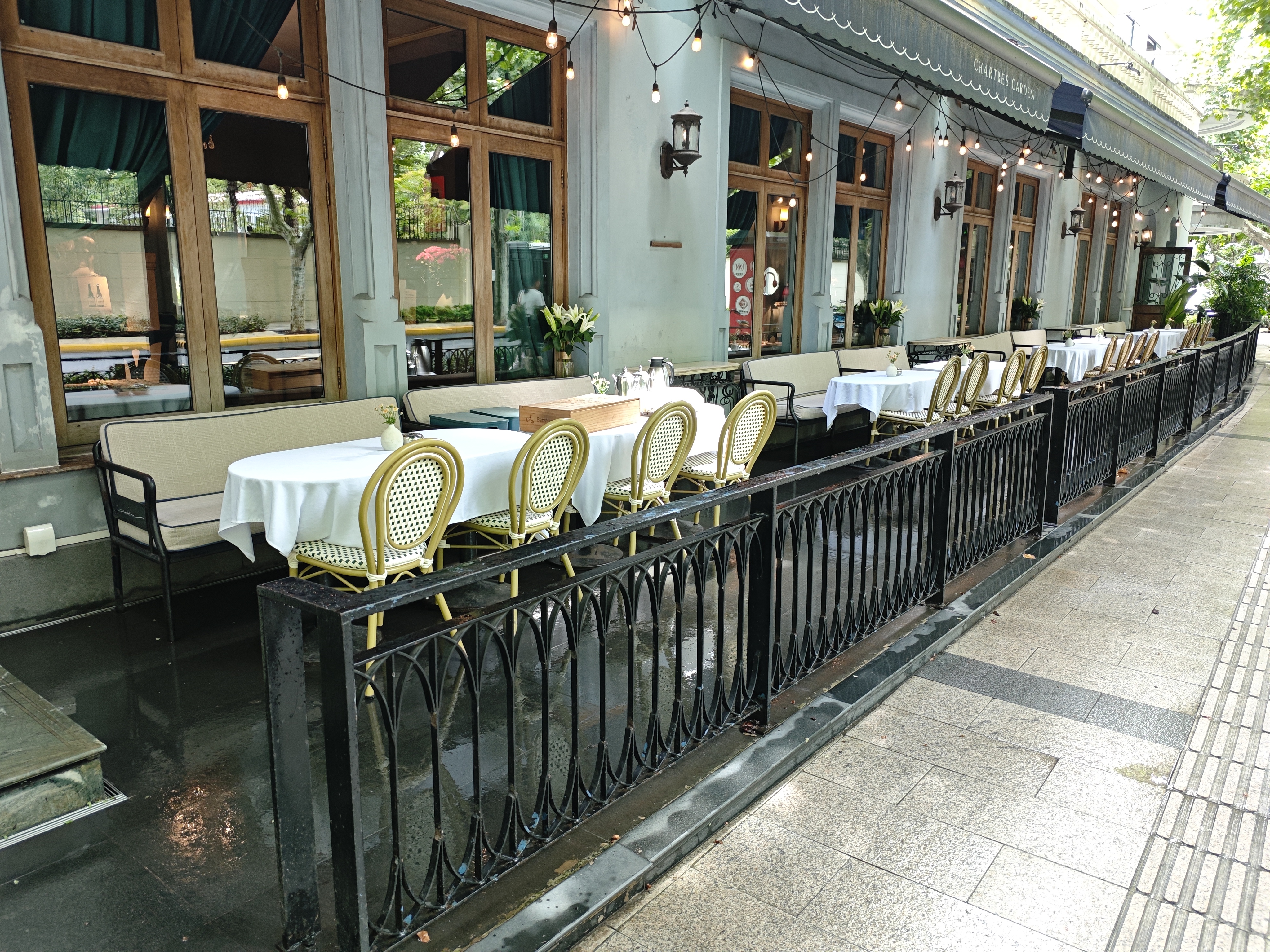 Black iron railing fence along a restaurant terrace