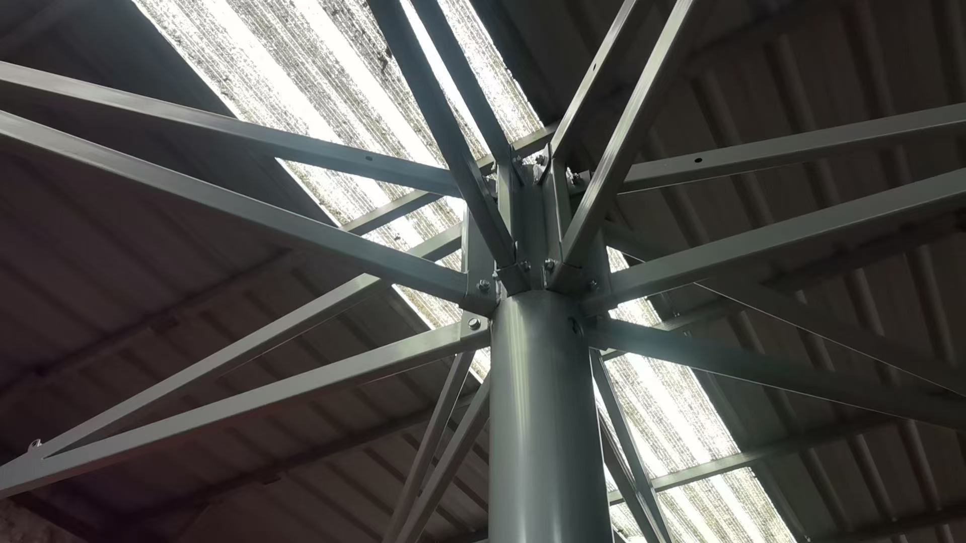 Steel umbrella frame with ribs radiating from a central hub